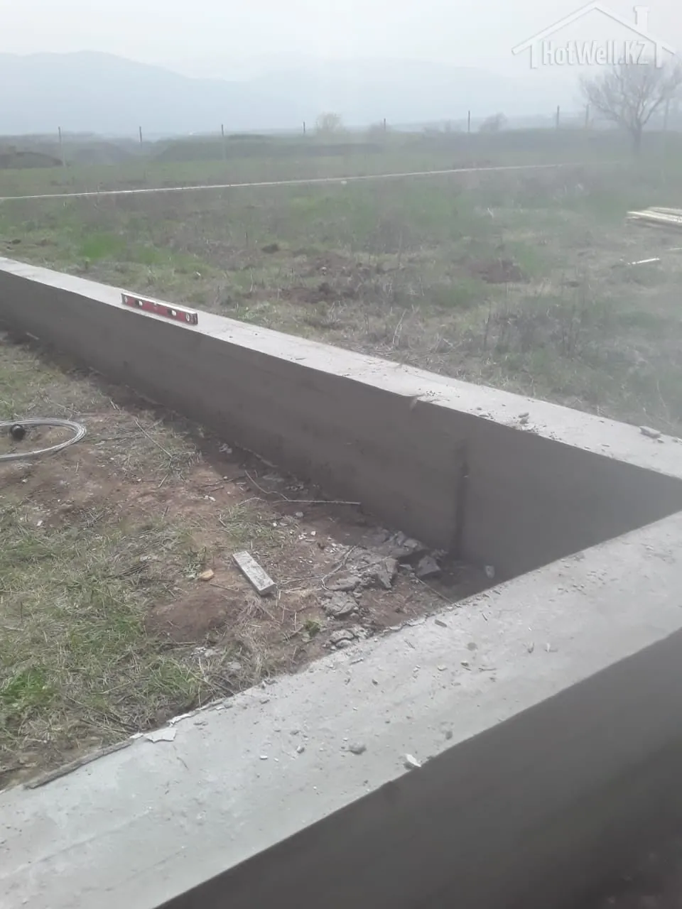 Проверка уровня бетонного ростверка фундамента дома «A-116»